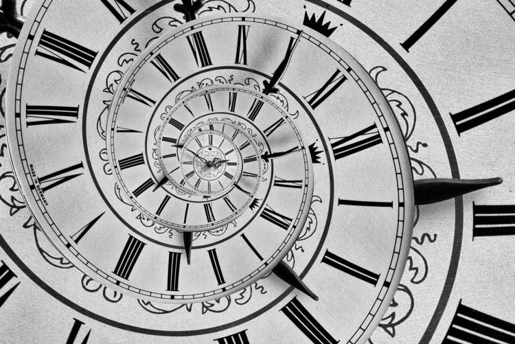 spiraling clock Roman numerals and hands