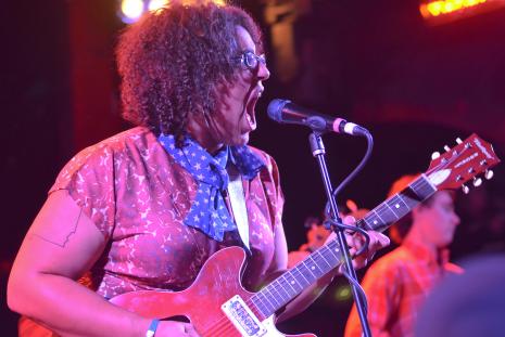 Brittany Howard playing guitar at a concert
